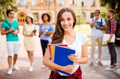 Student holding books.